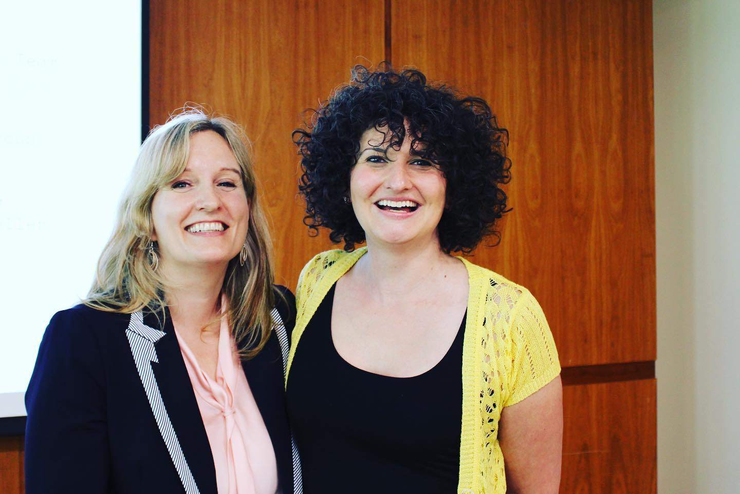 An author and an editor smile at the camera